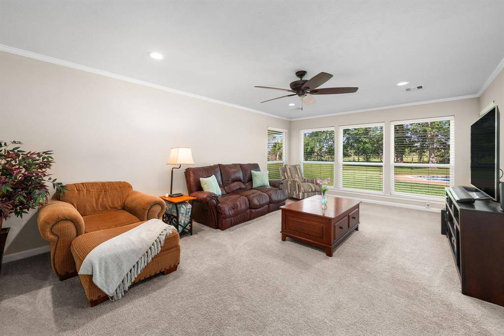 Den is a great area for kids while cooking or simply relaxing. More wonderful, large windows viewing backyard area.