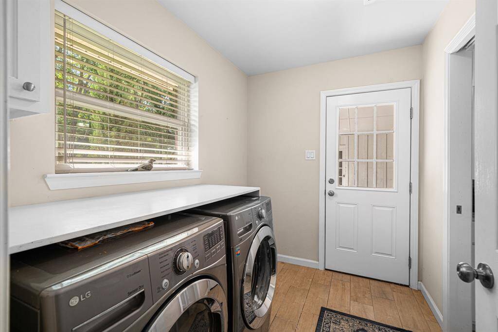 Utility room just off the kitchen. Plenty of folding/storage area over the washer and dryer.