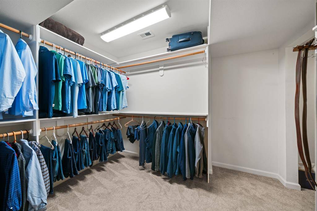 Master walk in closet, easy to keep order and organization. Storage for all your stuff.