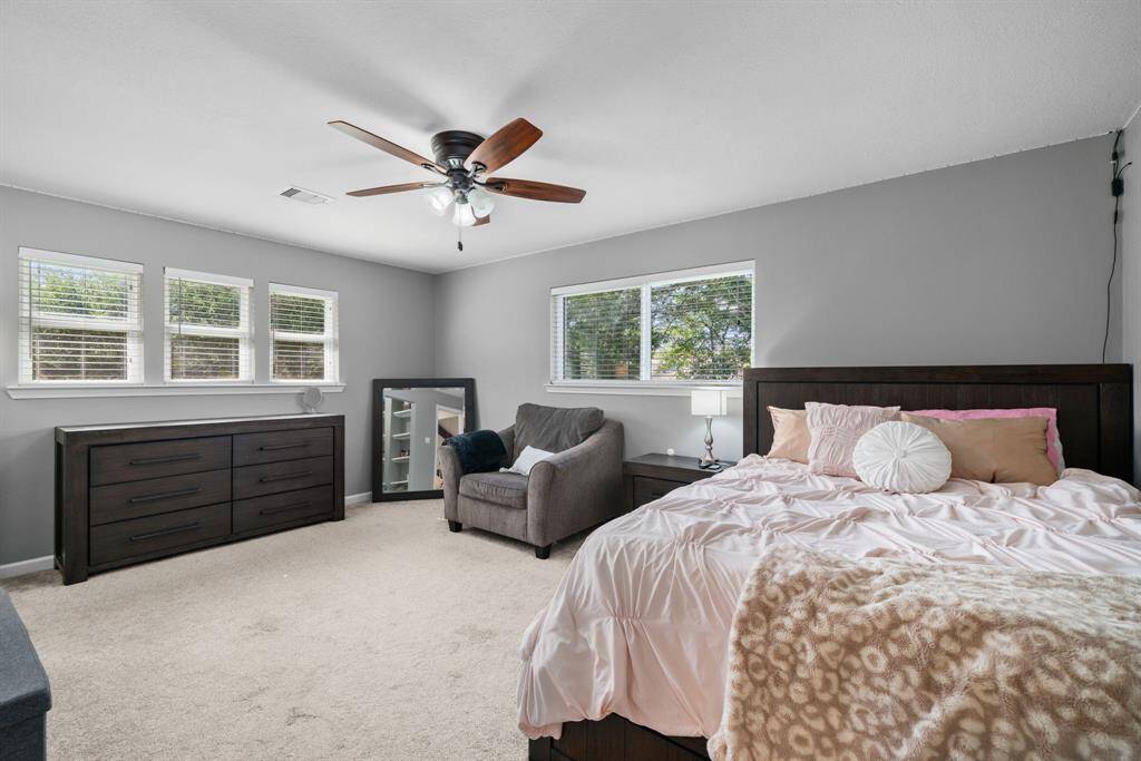 One of the two upstairs secondary bedrooms. Lots of natural light.