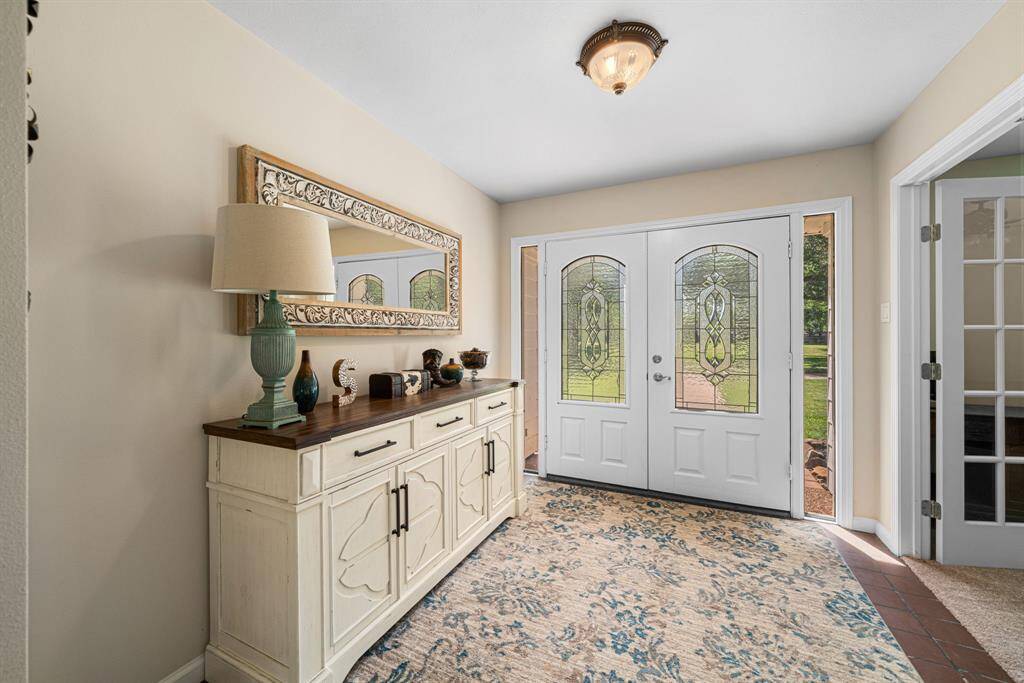 Large entryway with office to the right.