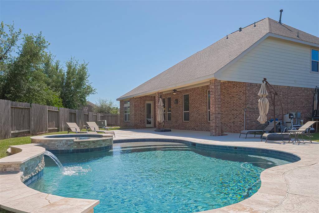 Dive on in to your new home at 13207 Spurlin Meadow!!