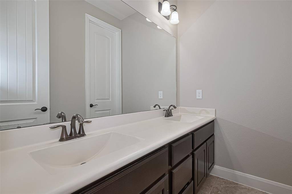Downstairs Secondary Bathroom with Dual Vanities separate from the rest of the Bathroom