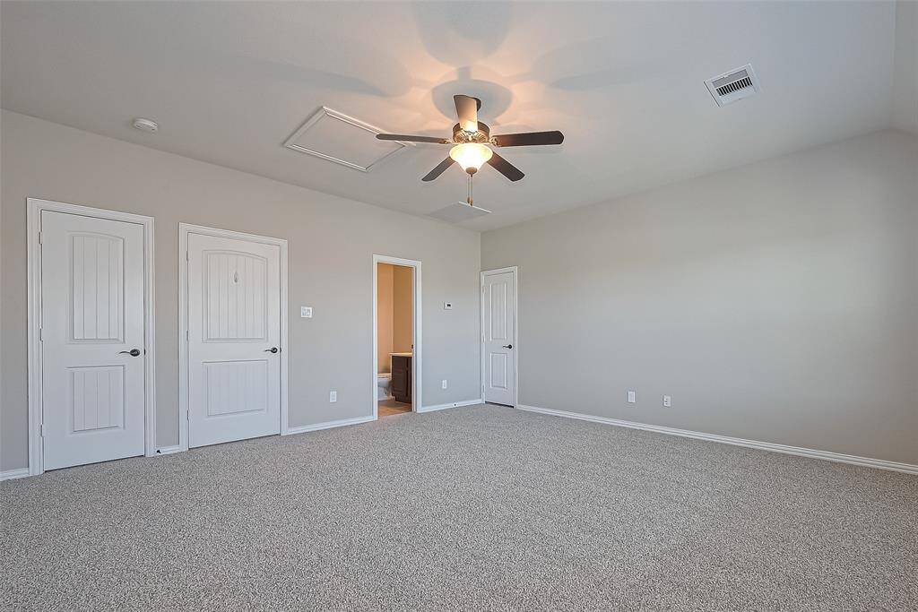 The door on the Left is to the Walk in Closet, the Middle door leads to downstairs and you can see a sliver of the Full Ensuite Bathroom on the Right