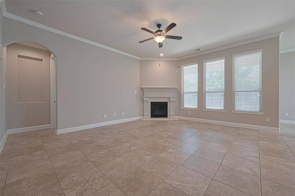 The Family Room/Den with Corner Fireplace