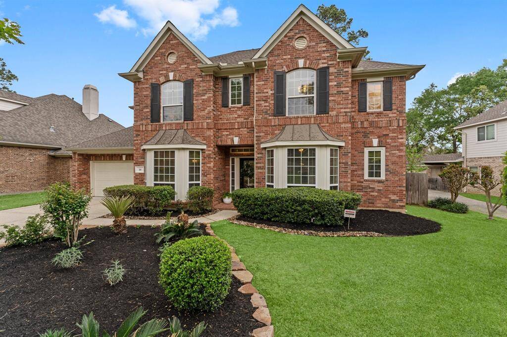 14 Monet Bend Place in Artist Grove offers timeless charm and modern convenience. From the intricate brick work, keystone detailing, contrasting shutters, and gorgeous landscaping, every detail adds to its impressive curb appeal. Inside, you'll find arched entryways, crown molding, detailed woodwork, and plenty of upgrades that make this home truly special. Roof new 2019. Hot water heaters 2018.