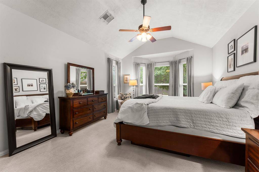 The inviting Owner’s Suite is a private retreat designed for ultimate relaxation. A stunning gambrel ceiling adds architectural elegance, while lush carpeting  and a stylish ceiling fan with light complete the refined look. Spacious, serene, and beautifully appointed — the perfect escape at the end of the day.