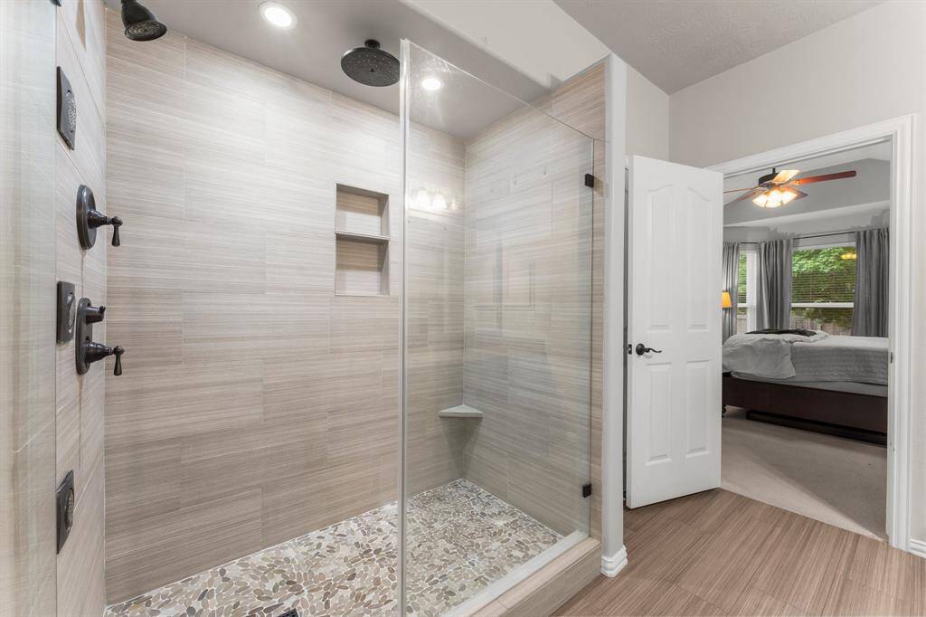 Unwind in the tastefully designed spa-like Owners’ bath. The large tiled shower with dual shower heads, body sprays, and built-in toiletry cubbies is perfect for an invigorating wake-up in the morning.