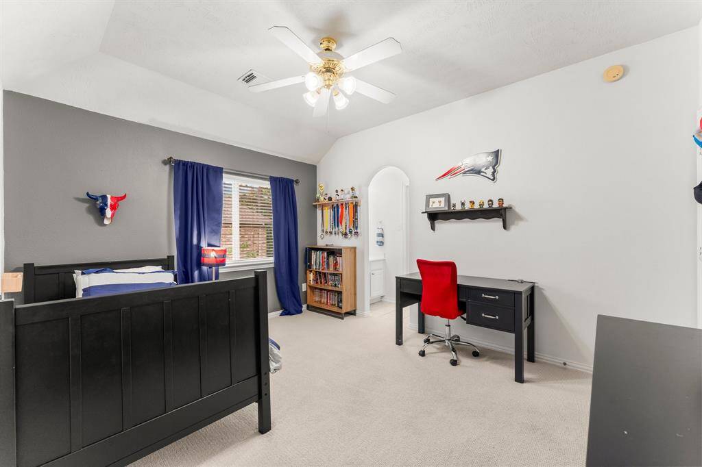 Another view of this secondary bedroom with a glimpse of the entrance to the Jack-and-Jill bath.