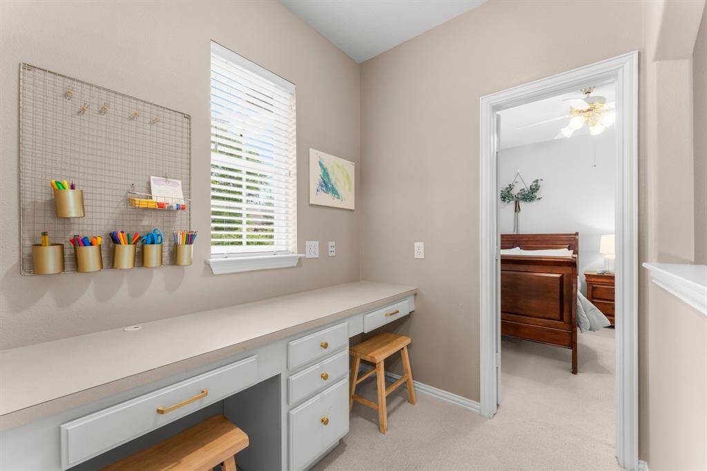 This computer niche area is located between two of the four secondary bedrooms.  It boasts a desk with  storage drawers,  knee space for two chairs, and a large window.  It could be used for a study or gaming area.