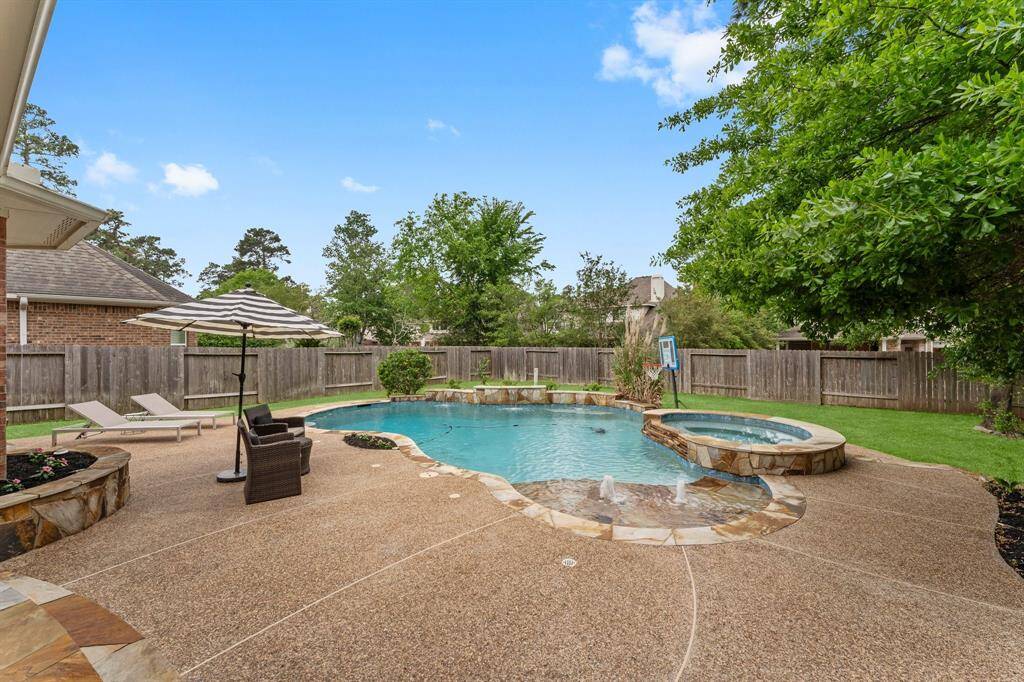 The heated pool with three cascading waterfalls and a spa for cold winter nights makes every day feel like a vacation, while lush landscaping adds privacy from the neighbors. Everything you need to relax and enjoy life! New in 2024 – pool pump, filtration system, and booster pump.
