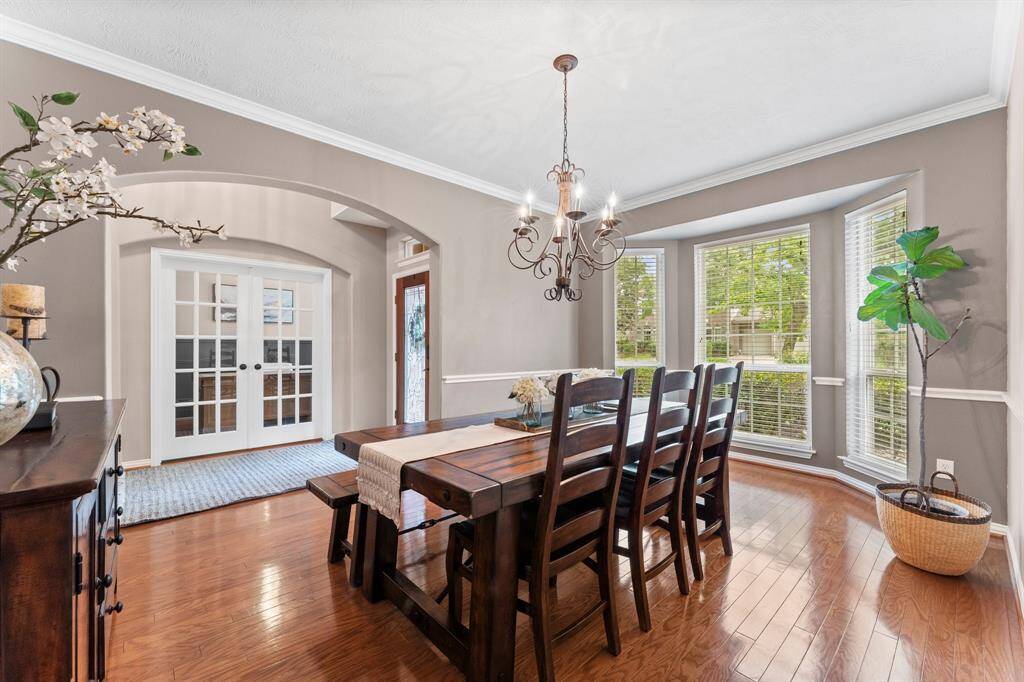 Dine in elegance in this stunning Formal Dining Room, where arched entryways and beautiful moldings create the perfect ambiance for entertaining. Whether hosting a dinner party or enjoying a quiet meal, this space adds a touch of luxury to every occasion. Click on the movie reel icon, or visit our on-line documents for a QR Code to see our walk-through video tour.