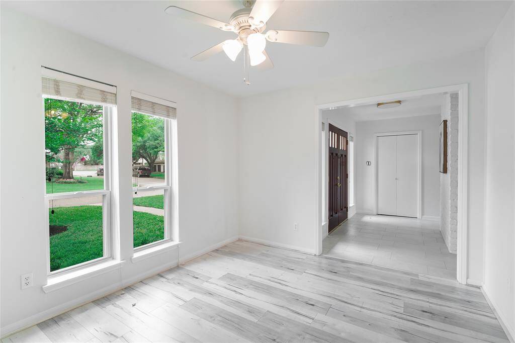 Formal dining area right next to the kitchen can easily fit a 8-seat dining tables and gets ample natural lighting.