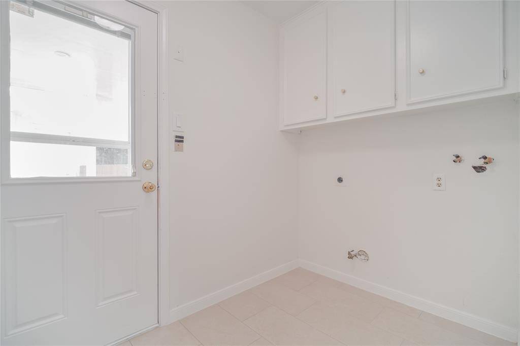 Mud Room/Utility Room with located ideally between the kitchen and the backyard door allowing private access to the homeowners form the garage/driveway to the kitchen.