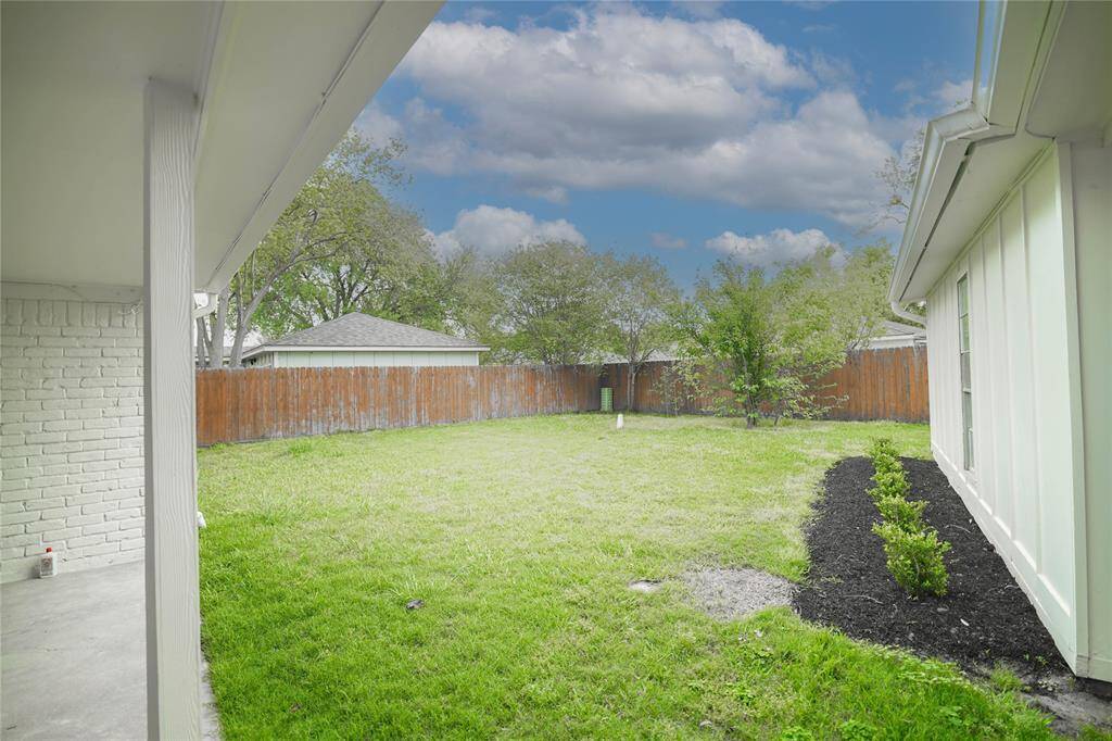 Backyard view and the covered patio.