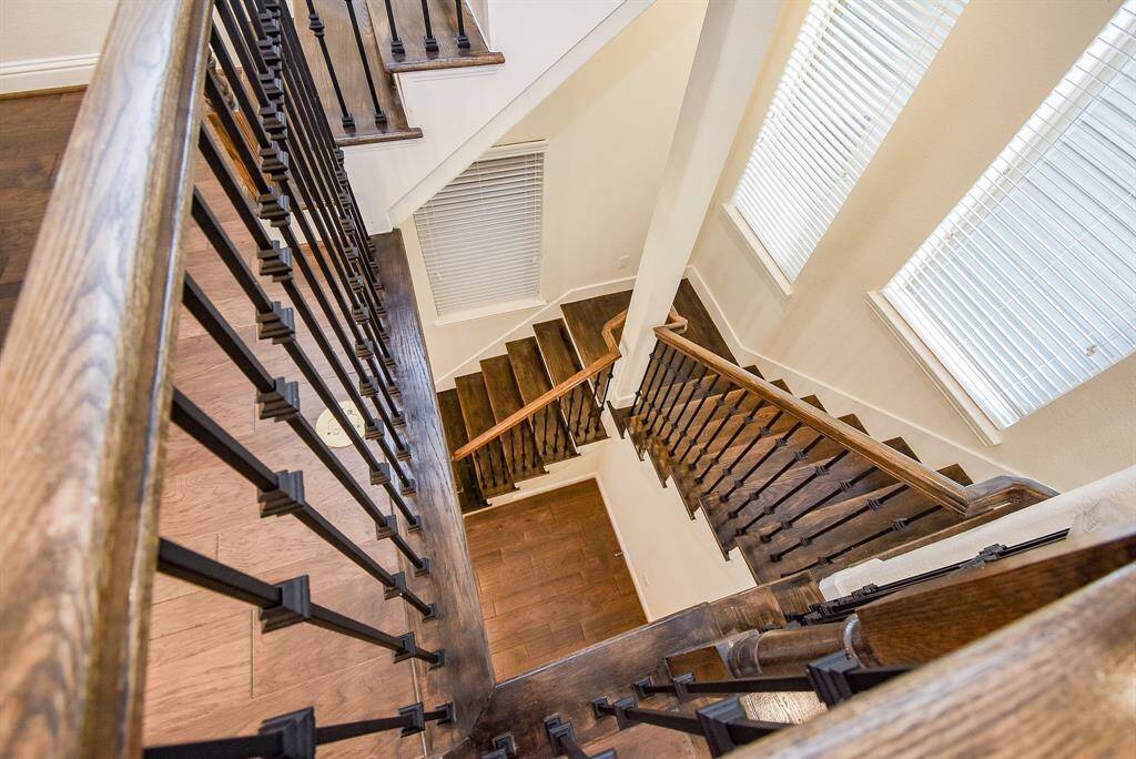 View of the sophisticated wood & iron stairs.