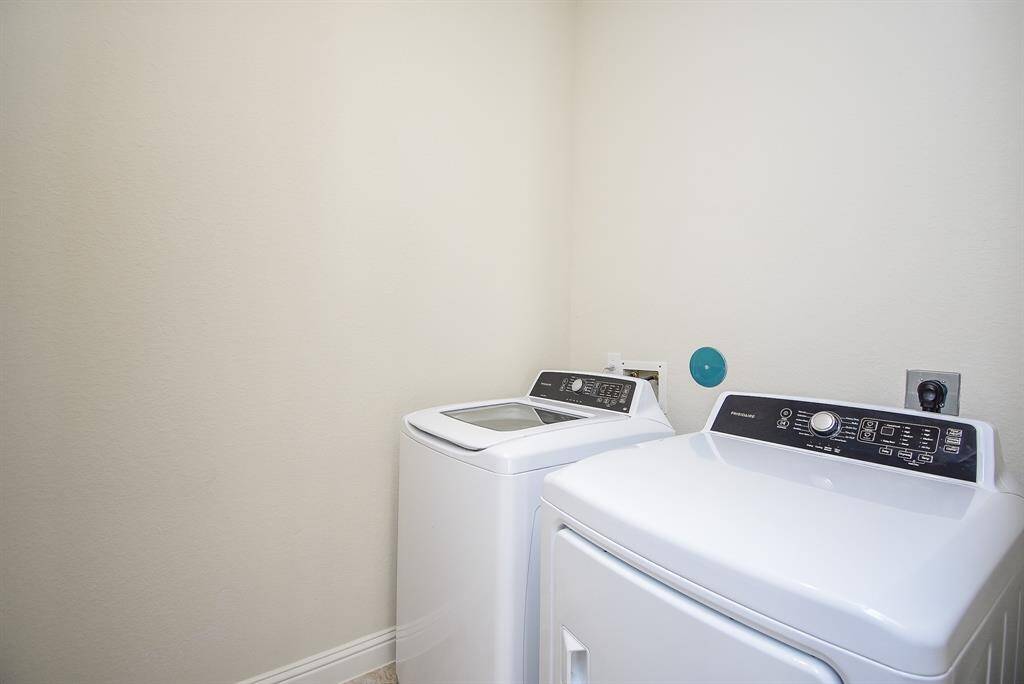 Laundry located on the third floor near the primary suite.