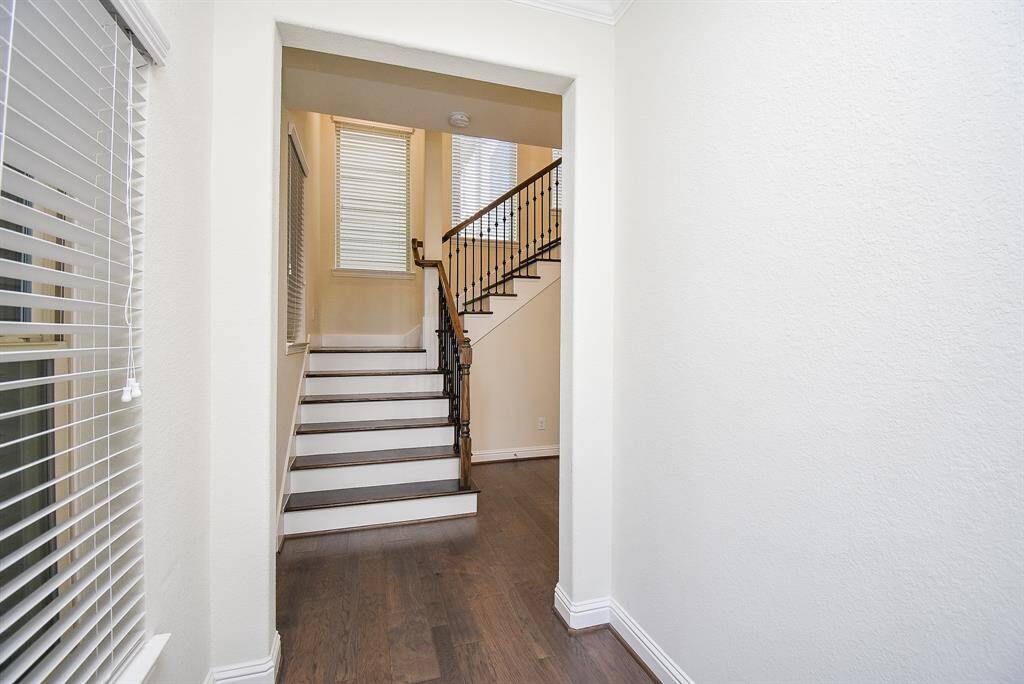 First floor features entryway, guest bedroom and abundant storage.