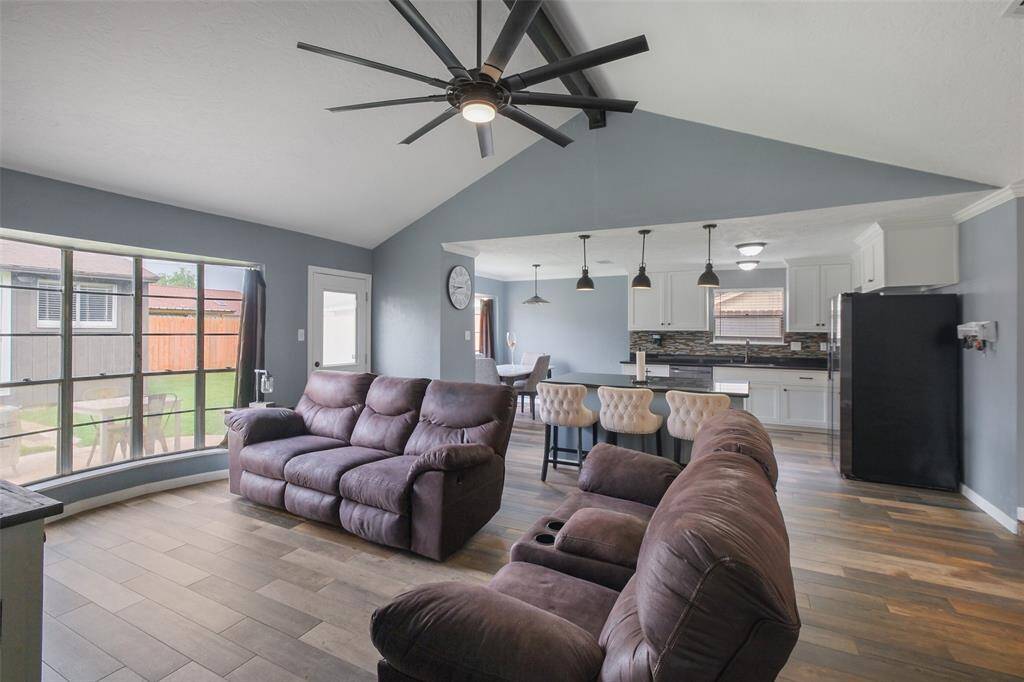 Spacious living with vaulted ceilings, wood floors, and tons of natural light!