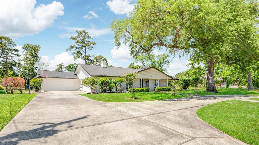 Home has additional parking with both double-wide driveway and circle driveway.
