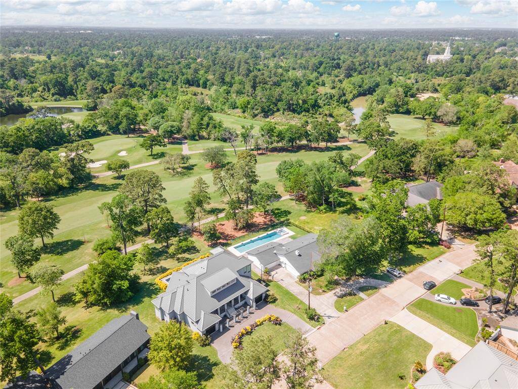 The home sits at the edge of the 5th hole of the Champions Cypress Green.