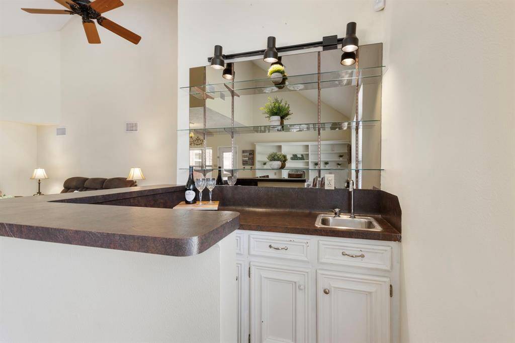 Get ready to entertain in style with this fantastic wet bar, complete with extra storage for all your essentials.
