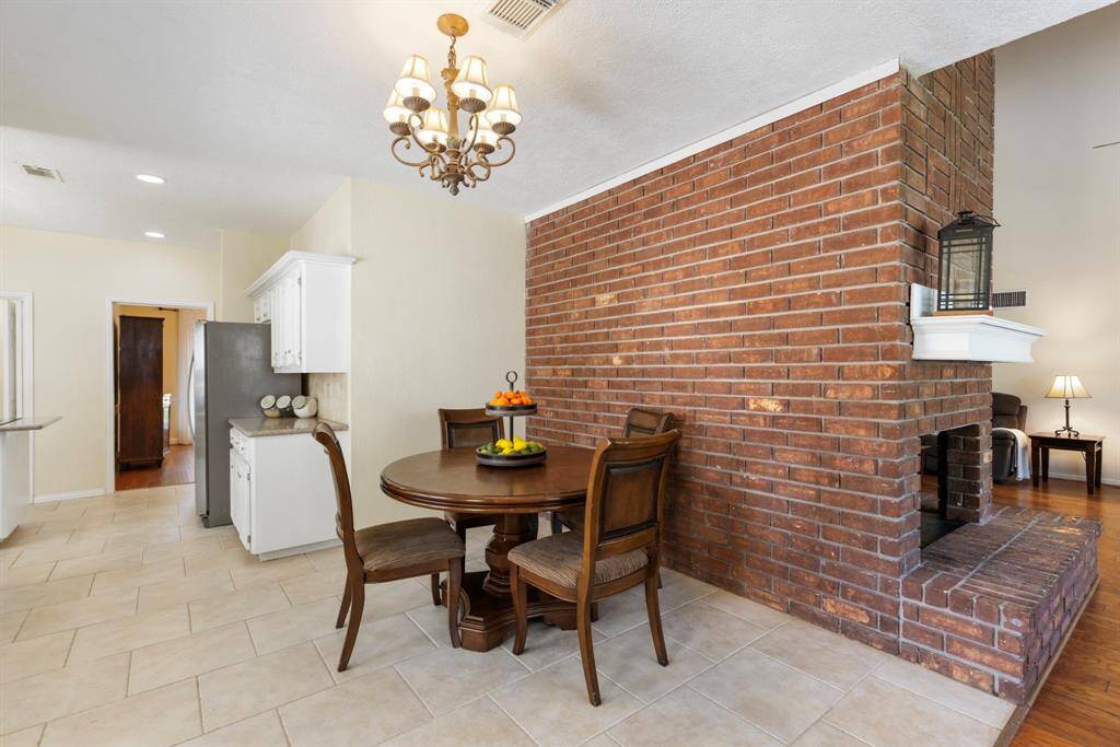 The cozy breakfast nook is perfectly situated just off the kitchen, offering both convenience and a charming spot to enjoy your morning meals.