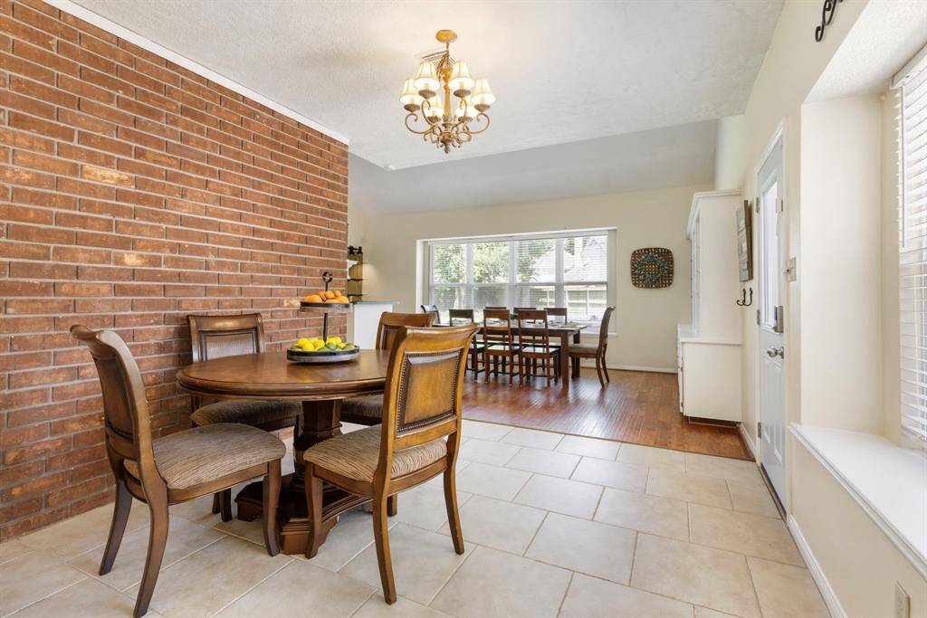 Looking from the kitchen, the breakfast nook offers a seamless connection, creating a cozy and functional space just steps away for casual dining or coffee breaks.
