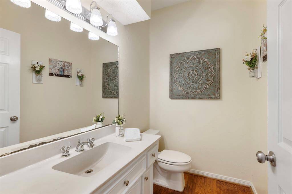 The half bath downstairs is conveniently located across from the formal dining/office space.