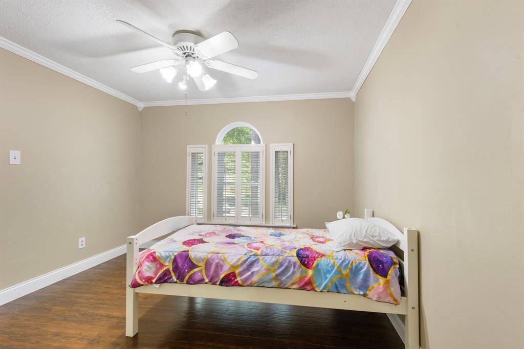 Another spacious secondary bedroom upstairs, bright and inviting with ample closet space.