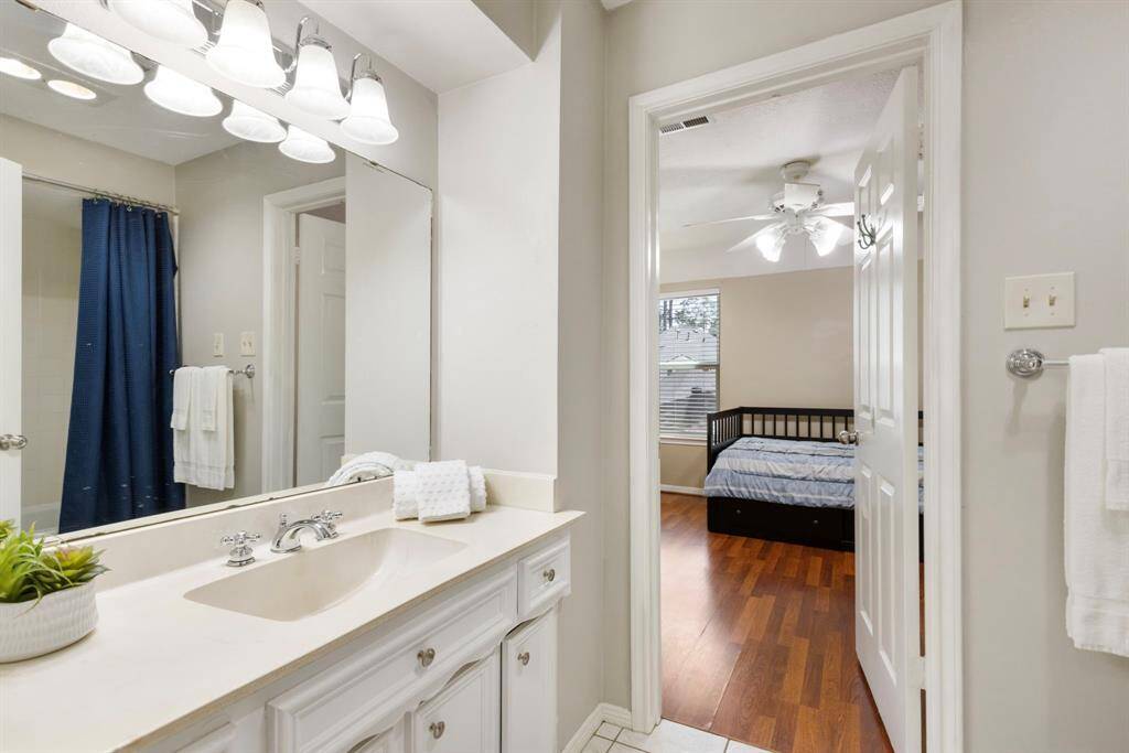 Full bath with tub/shower combo, conveniently serving the three bedrooms.