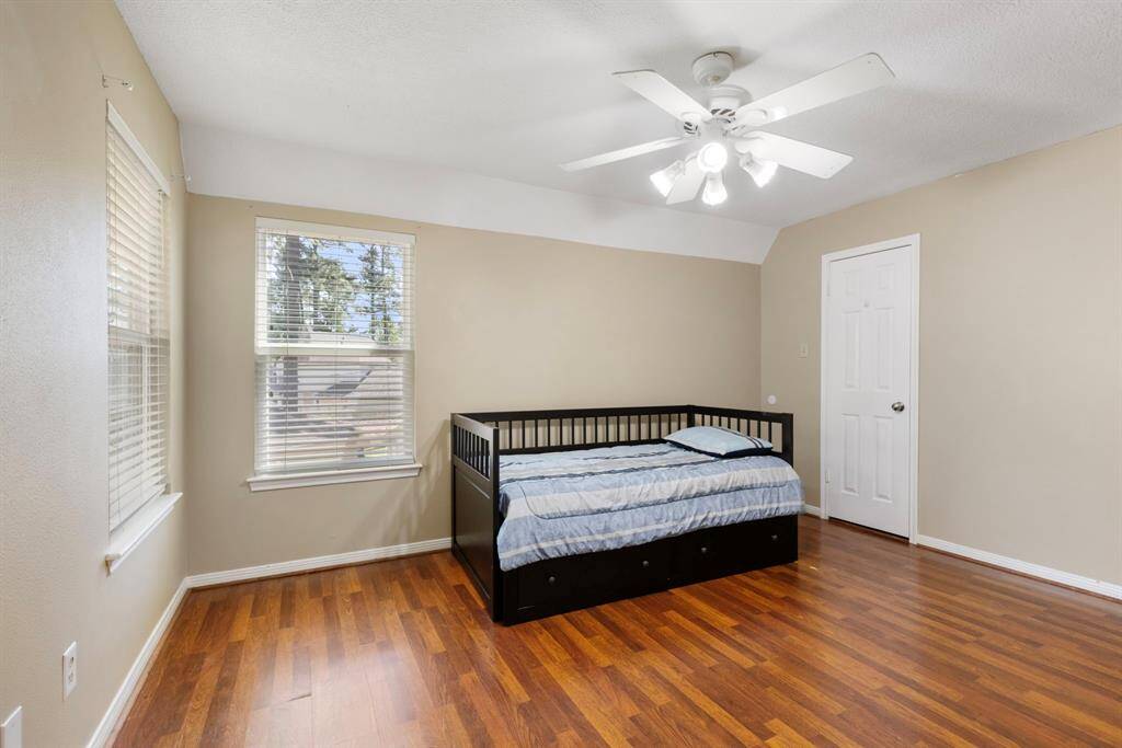 Cozy secondary bedroom on the third floor with plenty of natural light and a spacious closet.