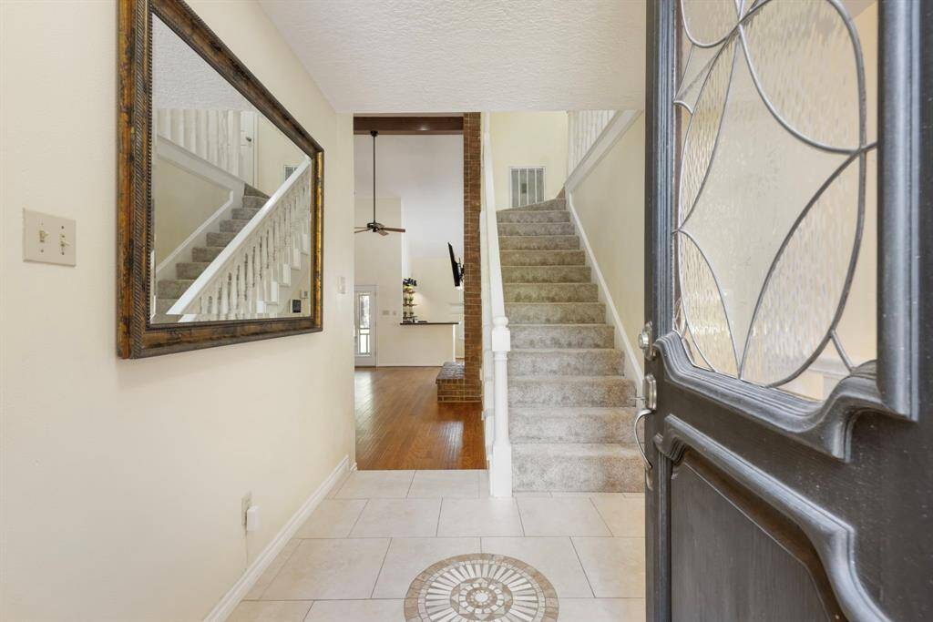 As you walk into the front door, you are greeted by the inviting foyer.