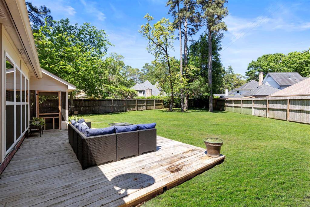 Relax on the large deck while enjoying the wide-open backyard views.
