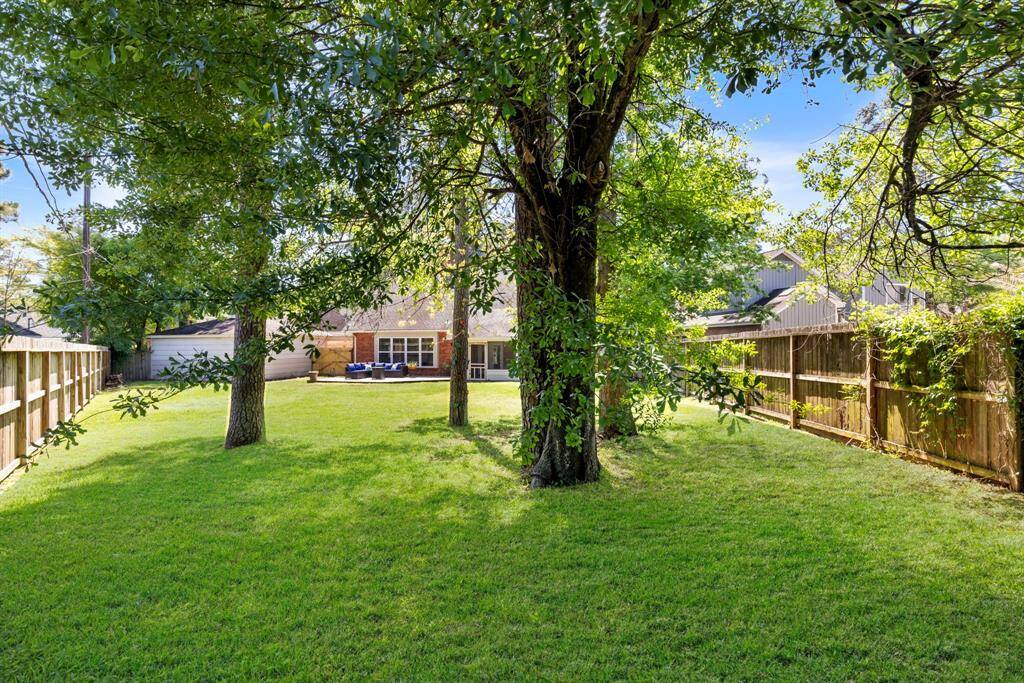 Gorgeous mature trees create a stunning backdrop, making the yard the perfect complement to this beautiful home.