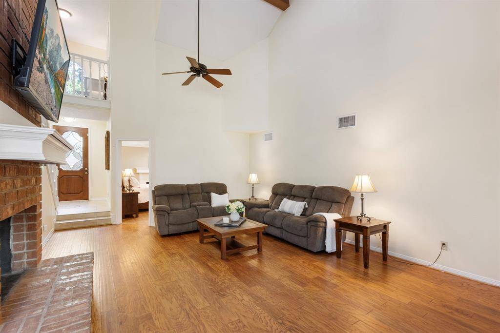 This living room offers the perfect balance between spaciousness and coziness, offering ample room for the entire family to come together and make lasting memories.
