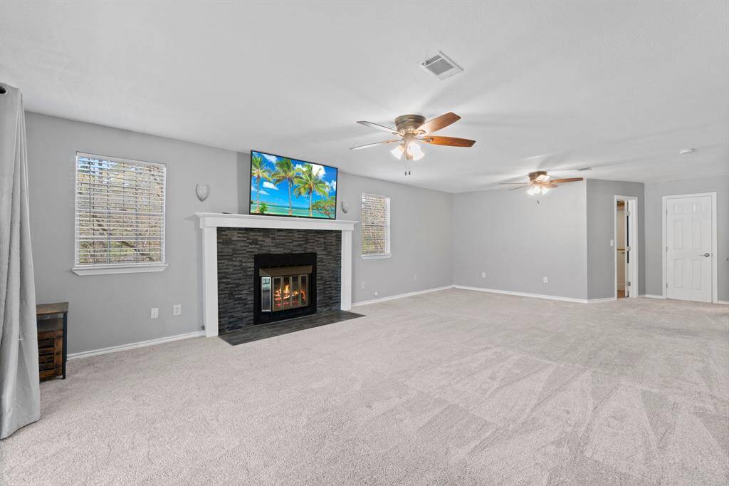 Primary retreat with fireplace and balcony