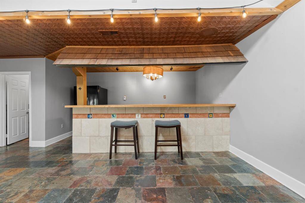 Wet bar/entertainment area in game room