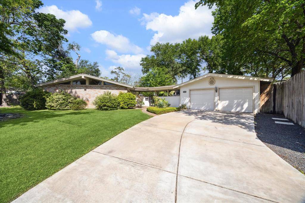The home sits on a 12,000+ sq ft corner lot and includes a recently poured new driveway!