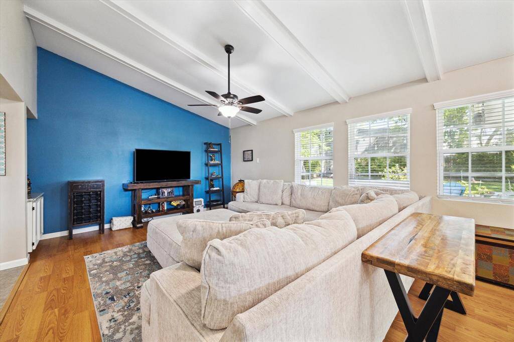 The living room boasts beautiful, vaulted ceilings and great natural light!