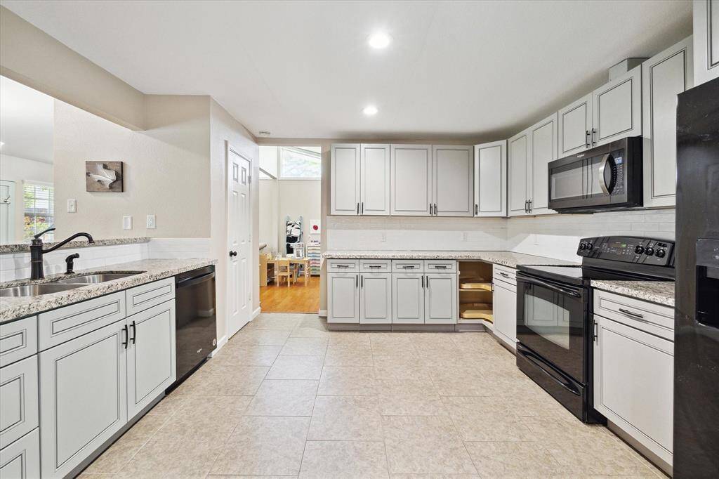 The sizeable and well-appointed kitchen provides a separate pantry, tons of storage and great counter space.