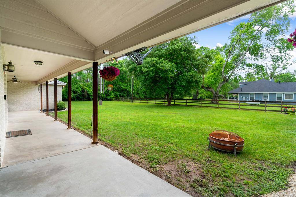 Enjoy peaceful views of the backyard from the extended covered porch along the back of the home. Offers a great spot for relaxing with morning coffee or unwinding in the evening while taking in the open green space.