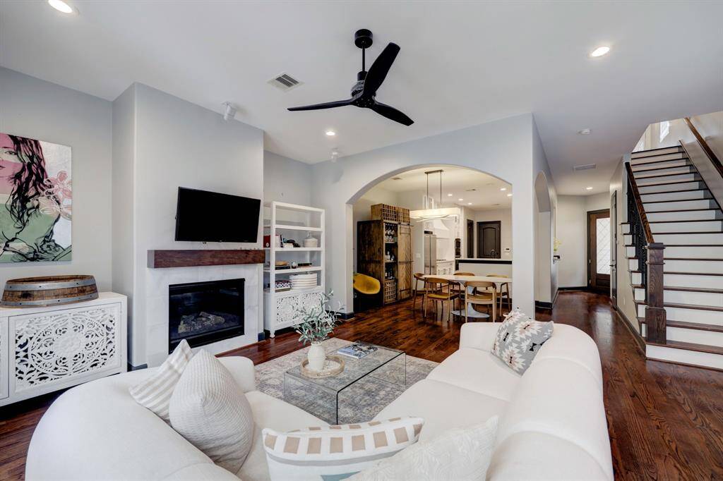 View looking back at the dining room and kitchen.  Stairway on the right takes you to the 3 bedrooms.