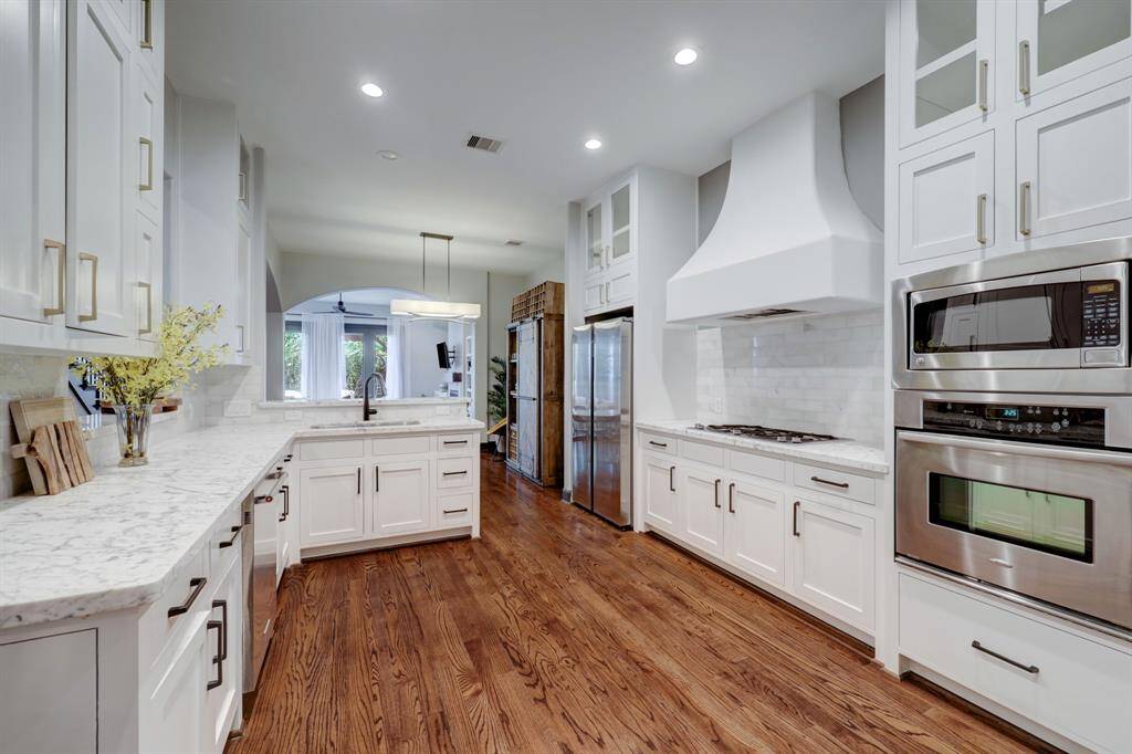 Stunning kitchen with stainless steel appliances and marble countertops.
