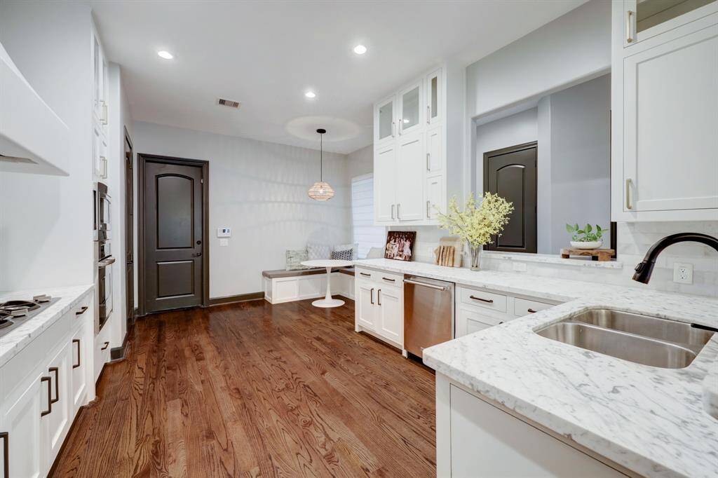 Another view of the kitchen. Plenty of room to add a small island in the middle.