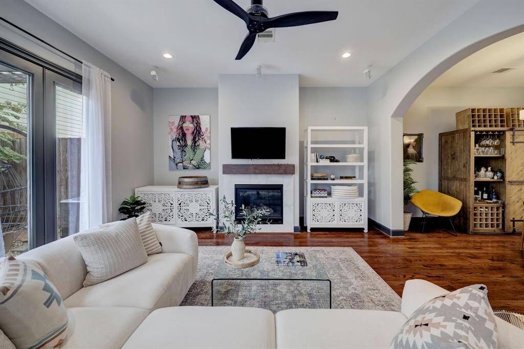 There is a spacious living room with a fireplace.