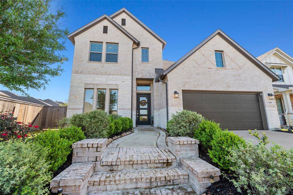 Beautiful brick exterior and a 3 car tandem garage