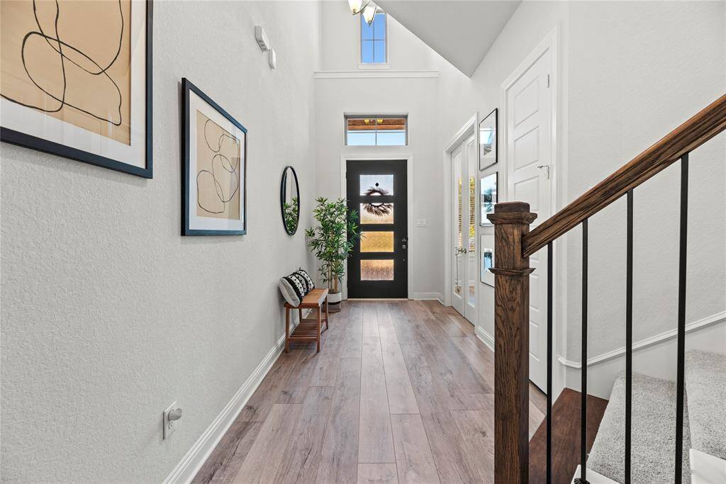 Luxury vinyl plank flooring continues throughout the home's main living spaces