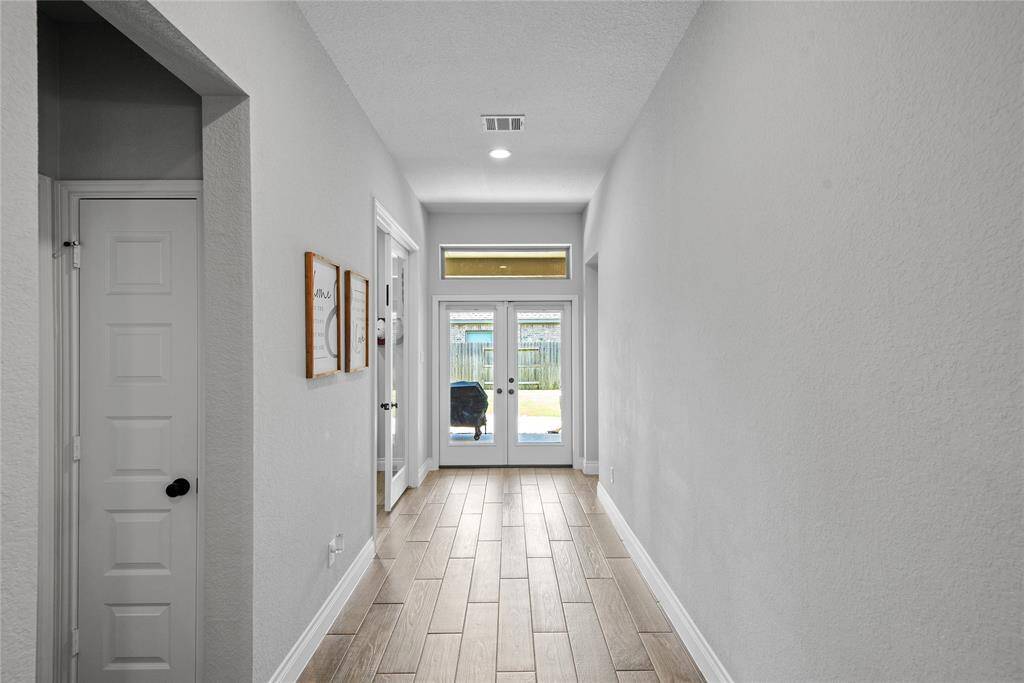 French doors leads to backyard