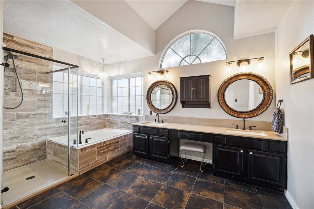 With a huge tub, large separate frameless glass shoer, double sinks, vanity area, and walk in closet, this has to satisfy your every need.